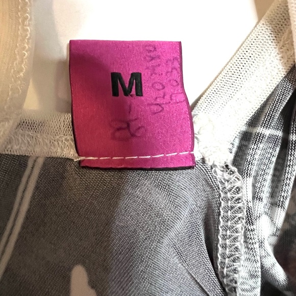 Save the Queen Ladies top. Medium Elbow length sleeves. Metal medallion accent. - Picture 10 of 13